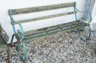 Wooden slatted garden bench with wrought iron scrolling ends, approx 150cm wide