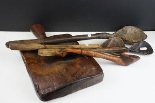 Antique carved wooden chopping block with handle together with four carved wooden ladle spoons