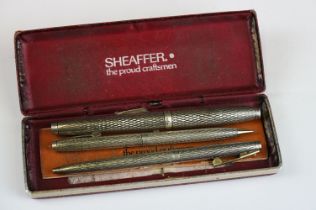 A Sheaffer sterling silver three piece pen and pencil set, to include fountain pen with 14ct gold