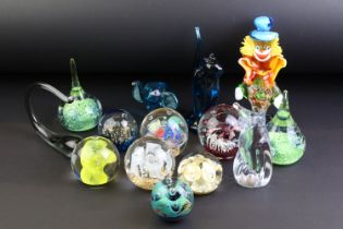 Collection of 20th century glass paperweights and ornaments, featuring a Murano clown (21cm tall),