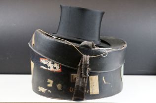 Early 20th Century Henry Heath collapsible top hat together with a leather bound travel case with