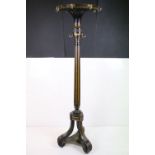 19th century Ebonised and Gilt Revolving Circular Coat and Hat Stand, the top with eight brass hooks