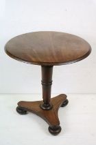 Mid 19th century Mahogany Circular Supper Table raised on a turned pedestal supports and a shaped