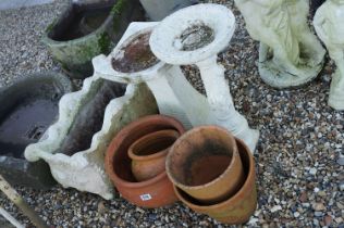 Group of four terracotta garden planters together with a reconstituted stone example, plus two