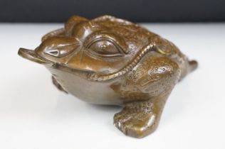 Cast metal Chinese lucky money toad modelled with three legs with moulded detailing and coin to