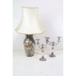 A ceramic oriental style table lamp together with two silver plated candlesticks.