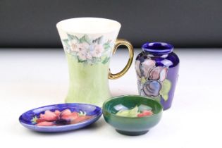 Group of Moorcroft pottery, 4 pieces, to include a hand painted floral mug of waisted form ('M.