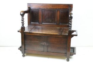 Early to Mid 20th century Oak Hall Seat with panelled back and lift up hinged box seat, the arms