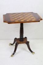 Mahogany Games Table in the Regency manner, the shaped chequered top raised on a pedestal base