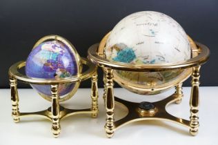 Two gemstone globes on brass stands, with built-in compasses to base, tallest approx 31cm high