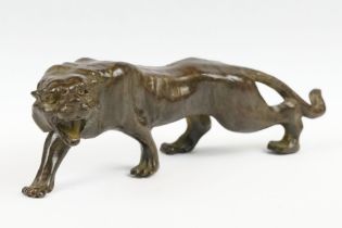 A Chinese bronze figure in the form of a tiger.