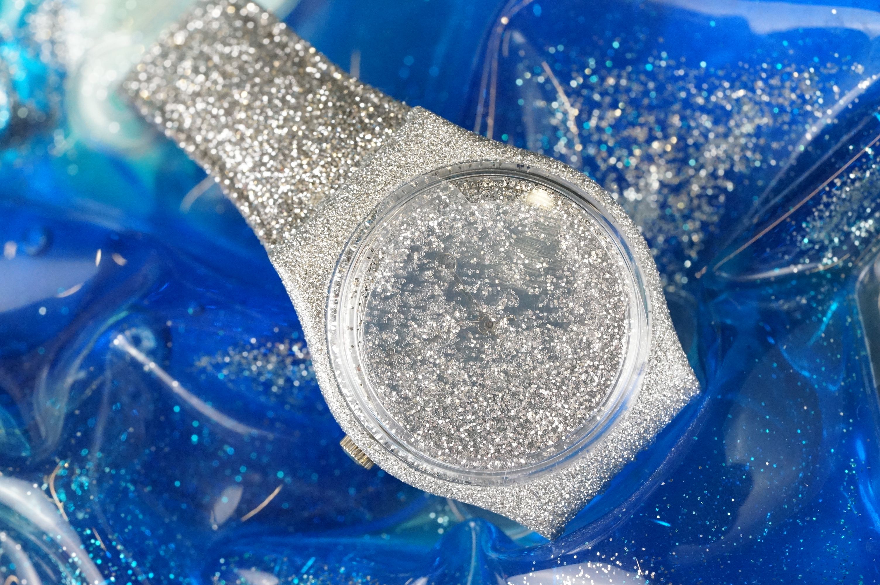 Swatch silver glitter watch having a silver glitter strap and further glitter housed in the face set - Image 2 of 5