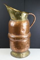 Large Early 20th century Copper and Part Brass Stickstand in the form of a Jug, 66cm high