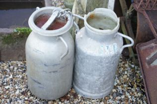 Two aluminium milk churns, twin-handled, of typical form, approx 53cm high