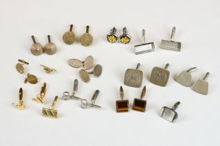 A collection of gents cufflinks to include hallmarked gold and hallmarked silver examples.