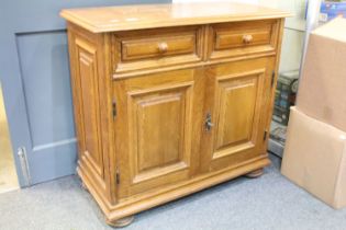 German Oak Dresser Base or Side Cabinet with two drawers over two cupboard doors, raised on bun