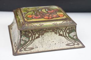 Early 20th Century Art Nouveau biscuit tin having cherries to lid with whip lash detailing. Measures