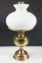 20th Century oil lamp with Austrian white glass shade, chimney, and a gilt metal reservoir & foot.