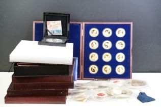 A large collection of mainly proof collectors coins contained within collectors display cases.