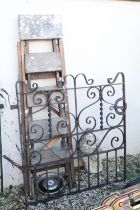 Wrought iron garden gate of scrolled design, measures approx 100cm wide; together with a wooden