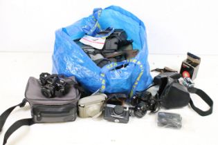 A collection of mixed camera's, lenses and accessories to include Canon, Ricoh and Olympus examples.