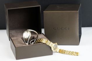 A ladies Gucci stainless steel wristwatch with display box together with a ladies Seiko wristwatch.