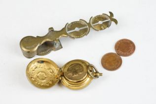 A set of antique brass sovereign scales together with a sovereign holder.