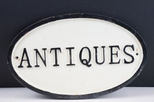 Cast Iron Oval ‘ Antiques ‘ Sign, 34cm long