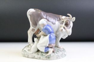 Bing & Grondahl B&G Copenhagen porcelain figure group of a milkmaid & cow, no. 2017, signed 'Axel