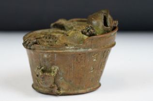 A Chinese cast metal incense burner in the form of Chan Chuy in the bath.