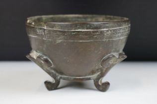 Chinese or South East Asian Bronze Pot raised on the legs, marked to base, 13cm diameter