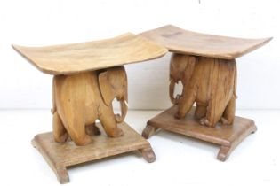 Pair of Hardwood Ashanti Stools, the supports carved in the form of Elephants, each 40cm high x 45cm