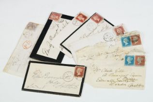 A small collection of Victorian stamps to include Penny browns and blues on original envelopes.