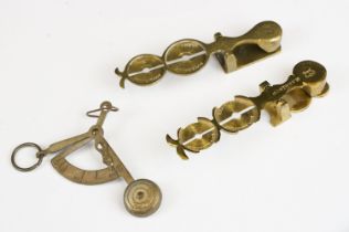 Two sets of antique brass sovereign scales together with a set of balance scales.