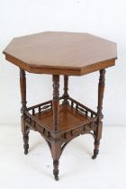 Early 20th century Walnut Octagonal Table raised on turned legs united by an undershelf and raised