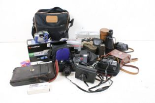 A collection of mixed photographic equipment to include film and digital camera's together with