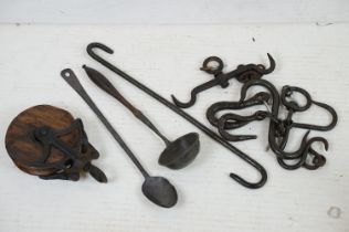 19th century cast iron & wooden pulley wheel (25cm long), together with a wooden handled ladle, hand