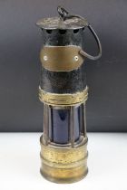 Late 19th Century / early 20th Century miners lamp having a swing handle to the top and blue glass