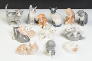 Group of Royal Copenhagen mini collection cats including single and group figures, 12 in total. Gilt