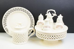 Large Leeds creamware cruet set, the stand with a band of geometric piercing, impressed mark to base