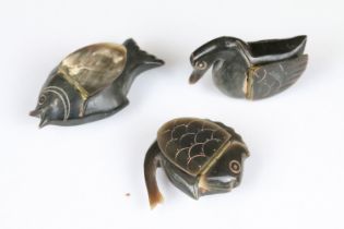 A collection of three carved horn snuff boxes in the form of animals to include two fish and a bird.