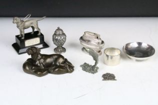 A box of mixed collectables to include a hallmarked silver napkin ring, table lighter, dog ornament,