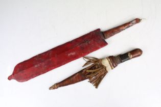 A vintage Kenyan Maasai warriors knife together with a small example.