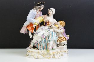 1920s German Meissen ceramic figurine group featuring a couple and child with hand painted detailing