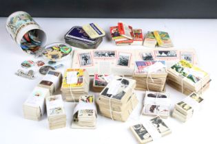 A box of mixed collectables to include cigarette cards, 1960's / 1970's button badges to include The