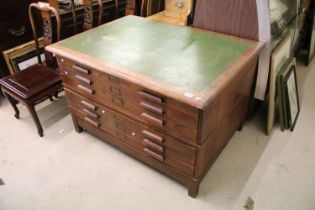 Mid century Oak Plan or Map Chest, the green leather inset top over six drawers with long block