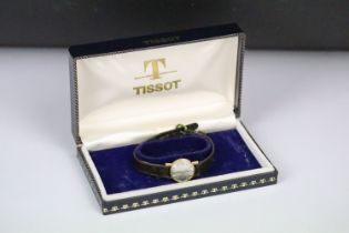 A ladies 18ct gold cased Tissot wristwatch within original box.