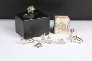 A collection of sterling silver and white metal miniature animal figures together with a