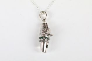 Silver dog whistle with ruby eyes and emerald collar, on silver chain