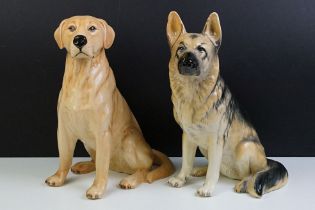 Two large ceramic dogs to include a Beswick German Shepherd and an unmarked Yellow Labrador (a/f).